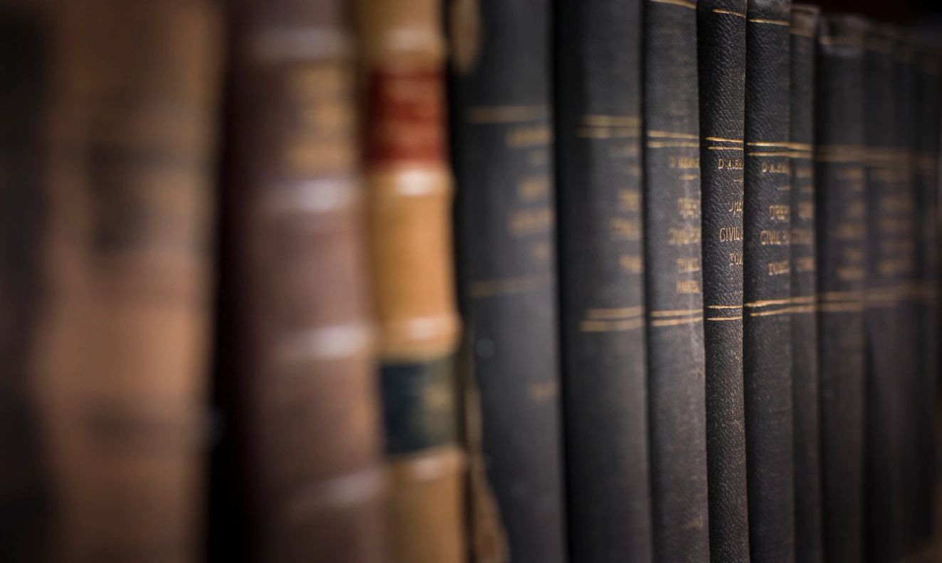 A row of books in a library with blurry images.